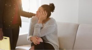 woman with mental health problems sitting down